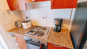 Luxury Apartment, Ocean View | Private kitchen | Fridge, microwave, oven, cookware/dishes/utensils