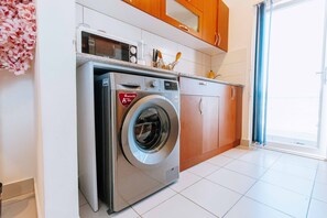 Luxury Apartment, Ocean View | Private kitchen | Fridge, microwave, oven, cookware/dishes/utensils