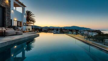 Outdoor pool, pool umbrellas, sun loungers