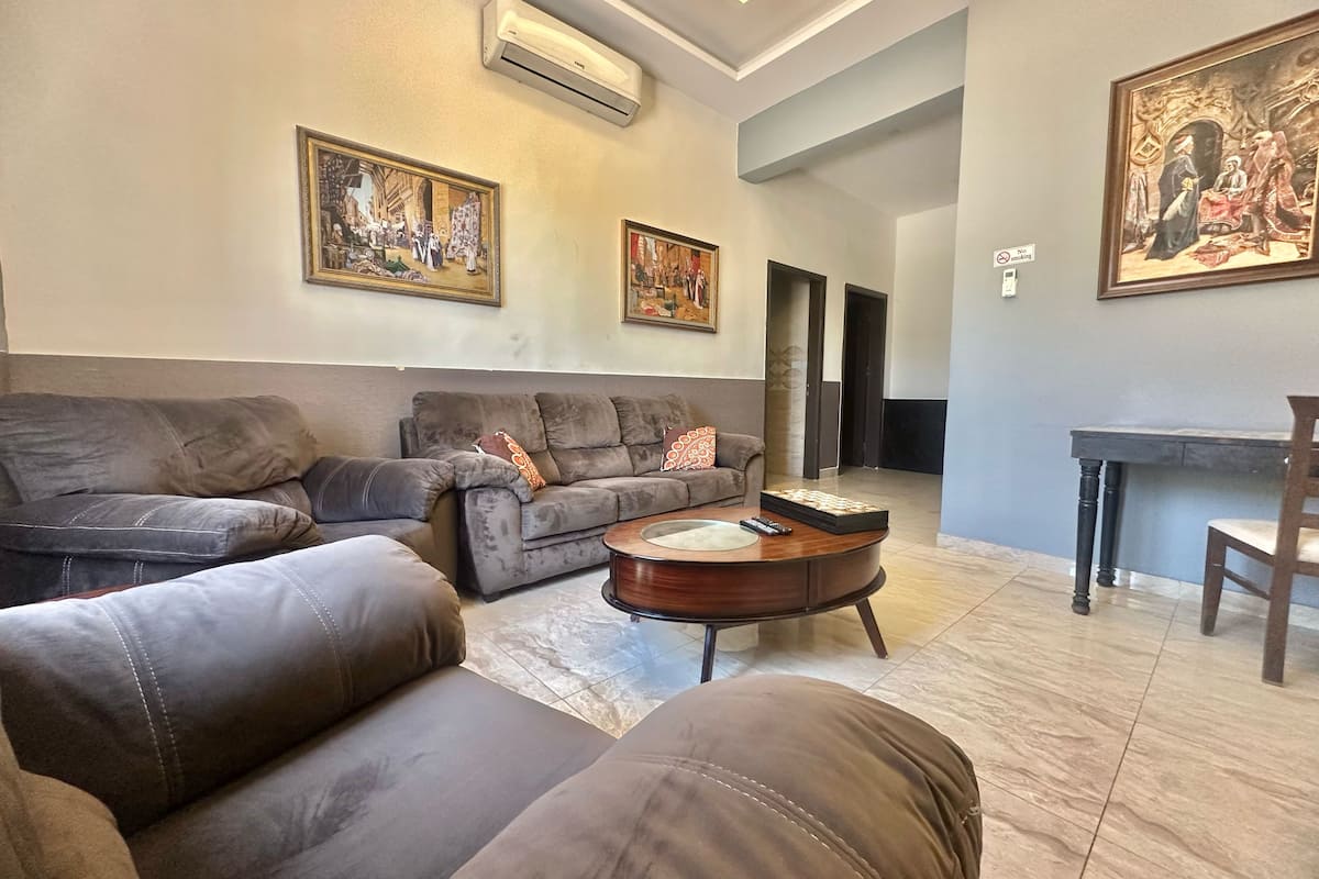 Family Apartment, Non Smoking | Living area | 45-inch Smart TV with cable channels