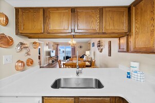 Condo, 2 Bedrooms, Beach View (715A) | Private kitchen | Full-size fridge, microwave, oven, stovetop