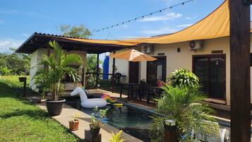 Outdoor pool, open 7:00 AM to 7:00 PM, pool umbrellas