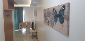 Family Apartment | Living area | 104-inch LED TV with satellite channels, iPod dock, printers