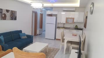 Una televisión LED, una estación de conexión para iPod, una impresora