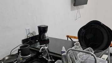 Fridge, stovetop, coffee/tea maker, cookware/dishes/utensils