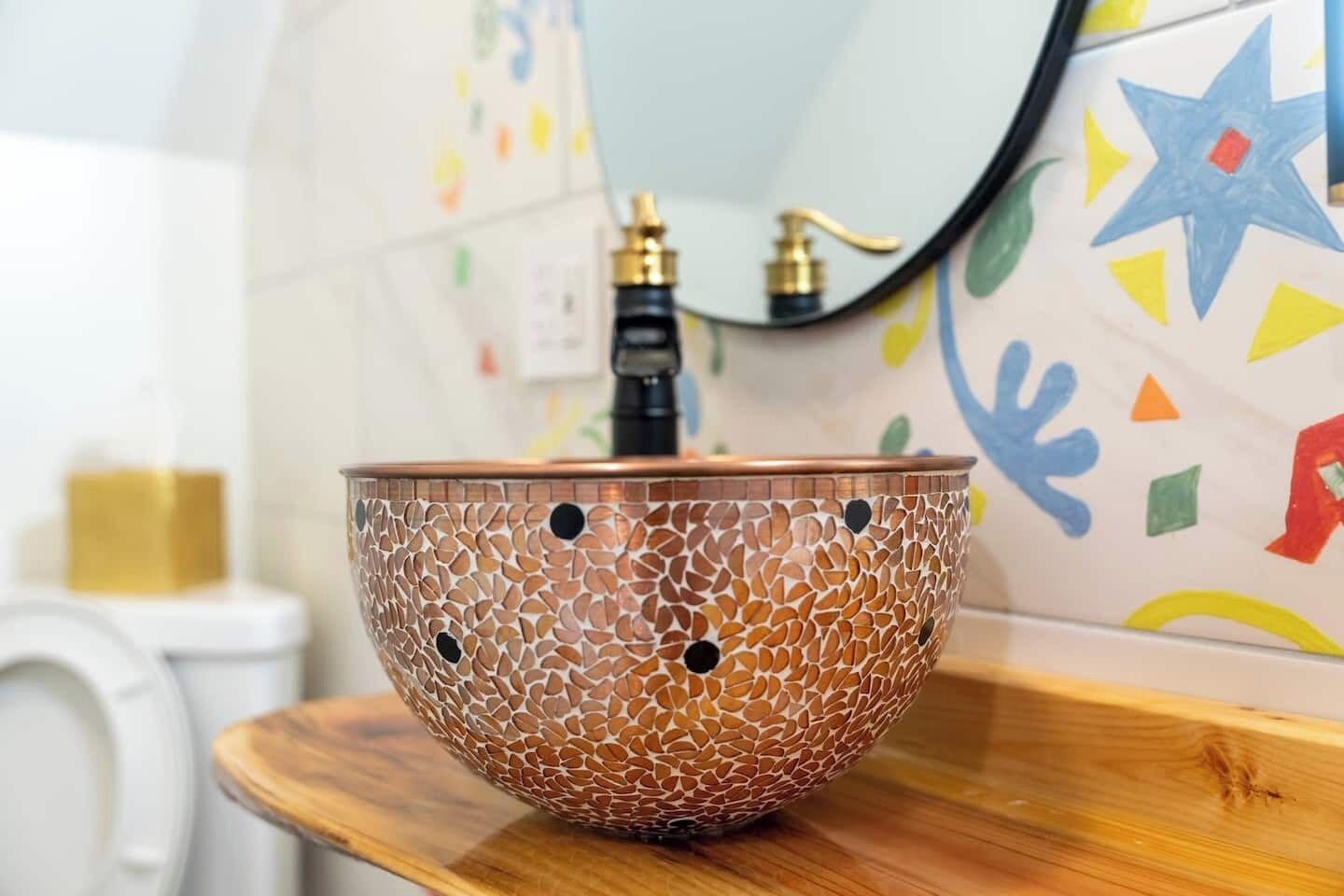 Our Master Bathroom boasts a unique and exquisite feature—an artisan-crafted copper hand-made bathroom sink.