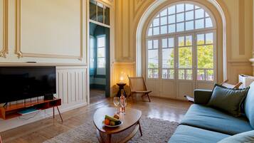 Standard Apartment | Living area | 40-inch flat-screen TV with cable channels