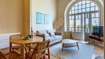 Family Apartment | Living area | 40-inch flat-screen TV with cable channels