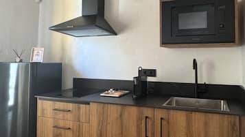 Microwave, coffee/tea maker, toaster, cookware/dishes/utensils