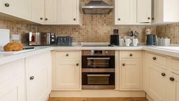 Fridge, electric kettle, toaster, cookware/dishes/utensils