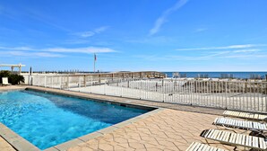A swimming pool with a view of the beach and ocean. - Caribbean (Gulf Shores)