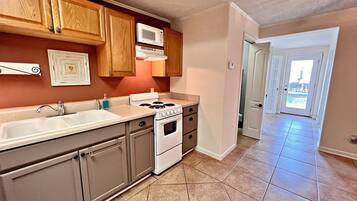 House, Multiple Beds, Patio (Porpoise Pass) | Private kitchen | Coffee/tea maker