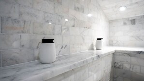 A bathroom with marble walls and a white countertop. - Luxury Townhome Minutes From DC (Alexandria)