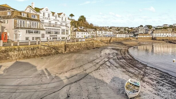 A coastal town with a prominent hotel named "The Castle Hotel" featuring a balcony and a visible red telephone booth. - 3 bedroom accommodation in St Mawes (St Mawes)