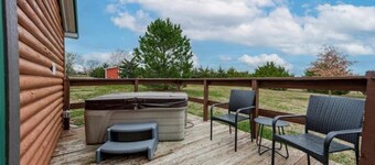 Cozy cabin retreat with private hot tub and breakfast