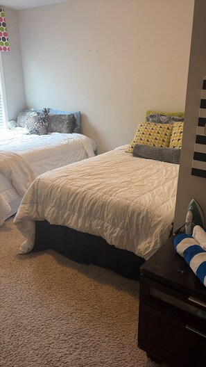A bedroom with two beds, a dresser, and a window with blinds. - Minutes to Six Flags, Walmart, and the #1 restaurant in town with gated fence!! (Douglasville)