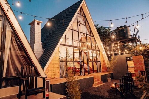 A frame 2-bedroom villa with pool.