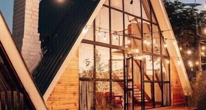 A frame 2-bedroom villa with pool.