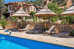 Seasonal outdoor pool, open 9:00 AM to 7:00 PM, pool umbrellas