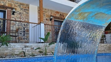Seasonal outdoor pool, open 9:00 AM to 7:00 PM, pool umbrellas