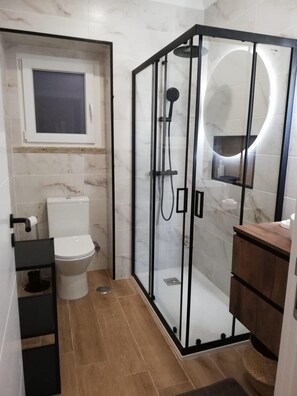 Shower, hair dryer, towels, soap