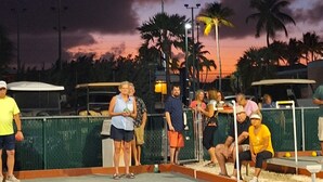 A group of people playing croquet at dusk. - Luxury Pull Thru Rv lot with access to all the Resorts amenities!  (Cudjoe Key)