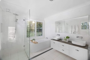 Shower, hair dryer, towels, shampoo