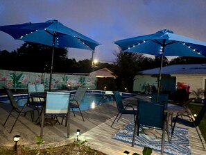 Outdoor dining - Mermaid Dreams: Spacious 3 bedrooms 2.5 bath with pool ALL in golf cart district (Ocean Springs)