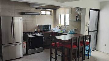 Microwave, oven, coffee/tea maker, cookware/dishes/utensils