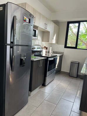Fridge, microwave, oven, coffee/tea maker - Our Apartment. The place where you'll begin and end your day of adventure (Santa Tecla)