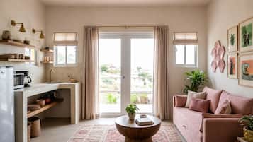 Suite Grand, Terraza, vista al océano | Área de sala de estar