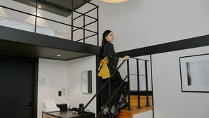A modern interior with a staircase, a desk with a phone, and a framed picture on the wall. - Mitasuya Ryokan Hotel Incheon by Anook (Incheon)