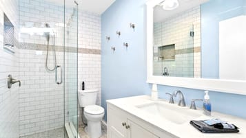 Shower, hair dryer, towels, soap
