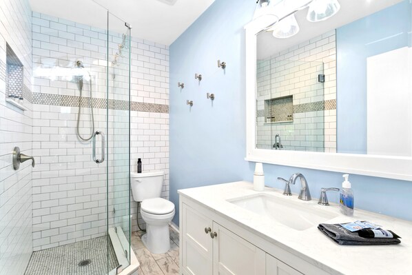 Shower, hair dryer, towels, soap