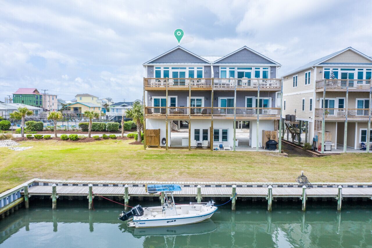 A waterfront property with a dock and a boat.