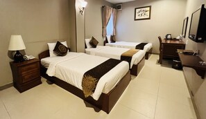 Triple Room, City View | In-room safe, desk, iron/ironing board, free WiFi