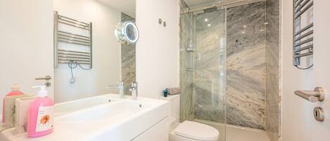 Shower, hair dryer, towels, soap