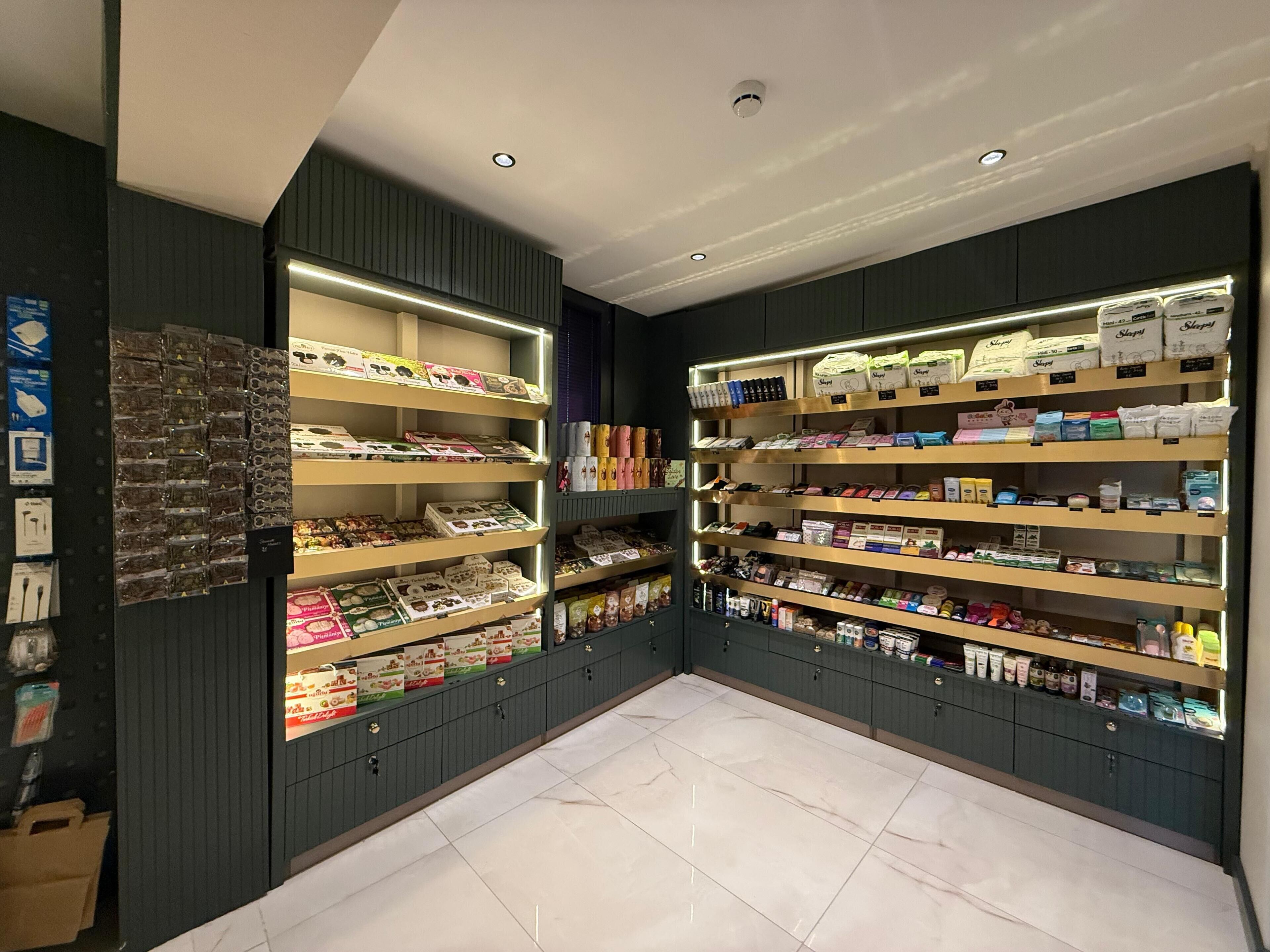 A store with shelves stocked with various packaged goods, including snacks and toiletries.