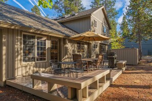 Outdoor dining - Splendid Sunriver Wooded Escape, SHARC Passes, Huge Deck w/ Private Hot Tub, Bikes, Games, and More (Sunriver)