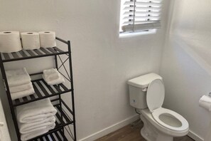Shower, hair dryer, towels, shampoo