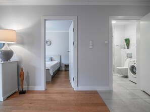 Enter a serene space with a comfortable bed and a convenient bathroom.
