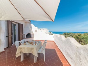 Outdoor dining - Nice apartment for 4 people with A/C, WIFI, TV, terrace and pets allowed (Valledoria)