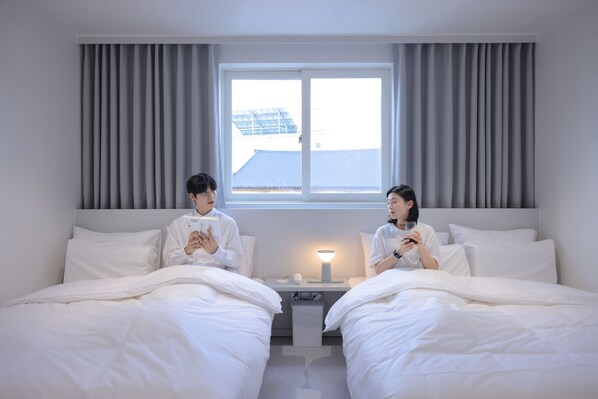 Camera con 2 letti singoli | Biancheria da letto di alta qualità, Wi-Fi gratuito, lenzuola