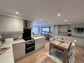 Microwave, oven, dishwasher, dining tables