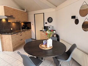 Fridge, stovetop, dishwasher, coffee/tea maker