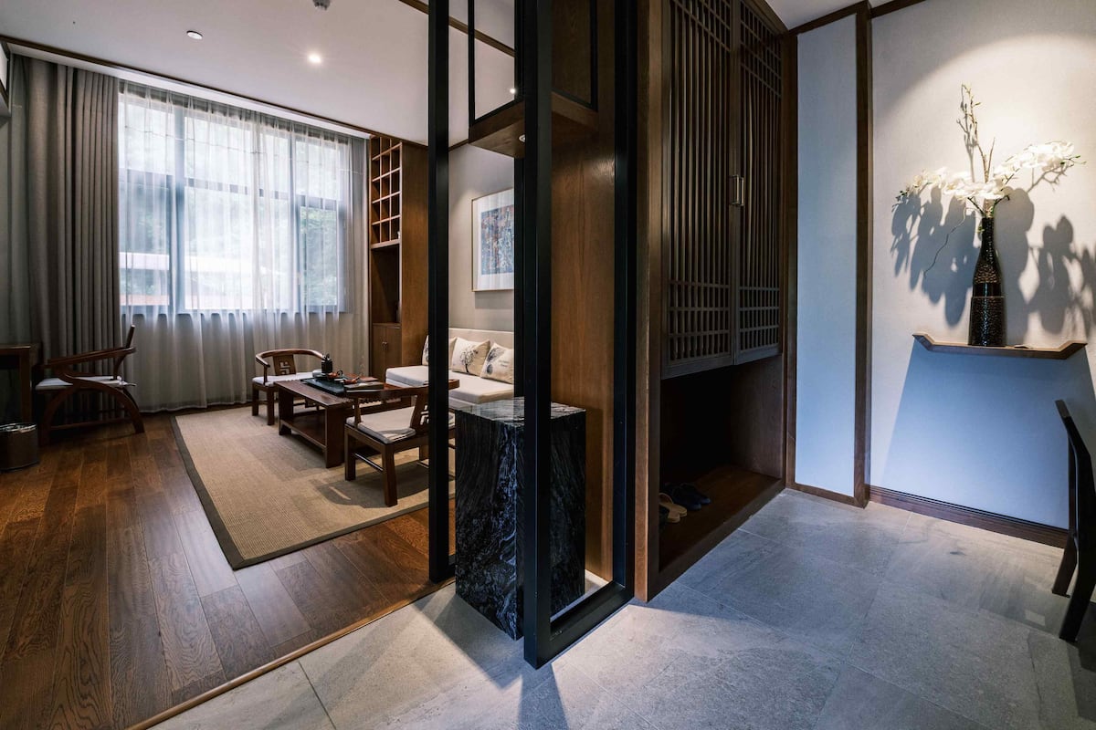 Exquisite Balcony Suite | Living room | 65-inch flat-screen TV with digital channels, TV, toys