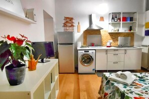 Fridge, stovetop, toaster, dining tables