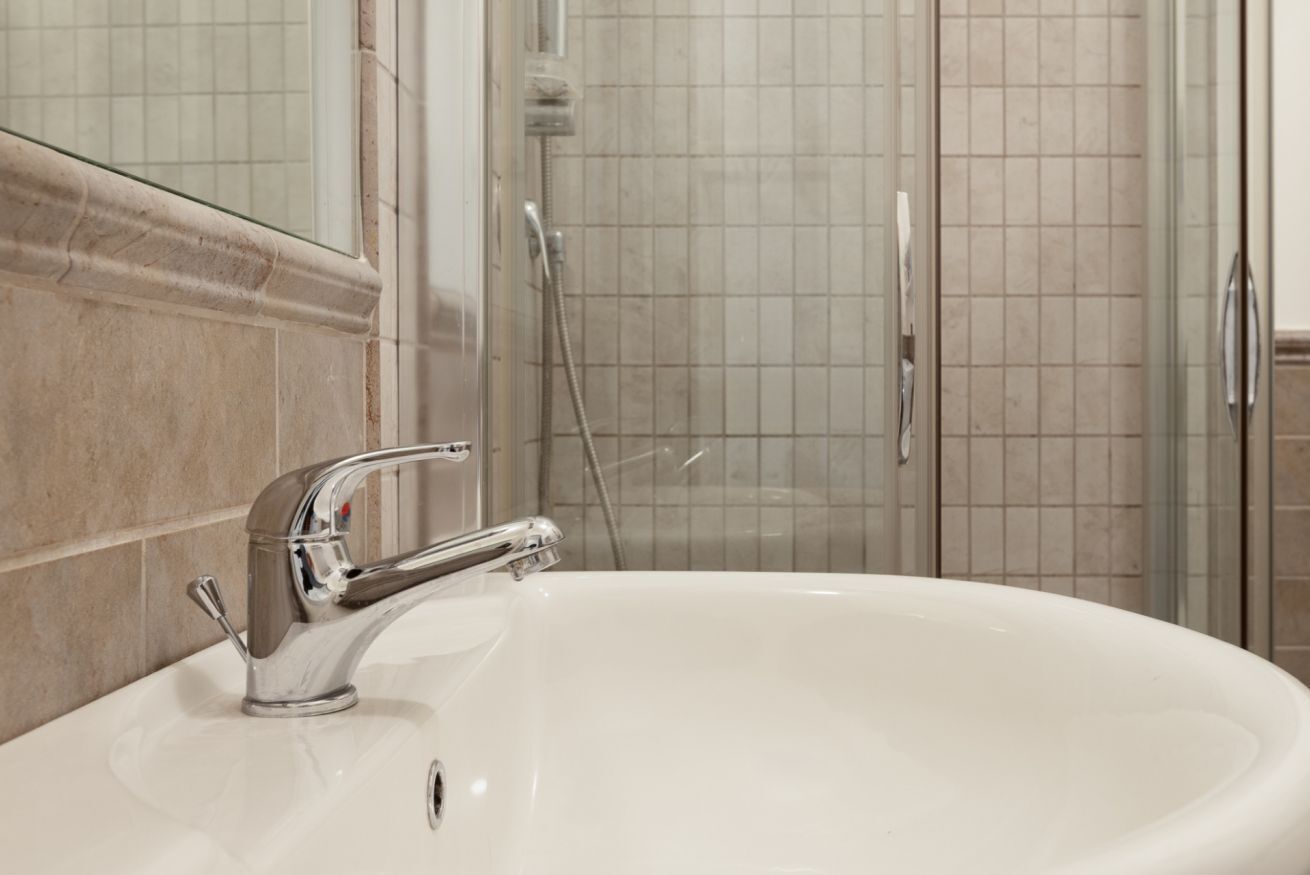 Shower, hair dryer, towels, shampoo