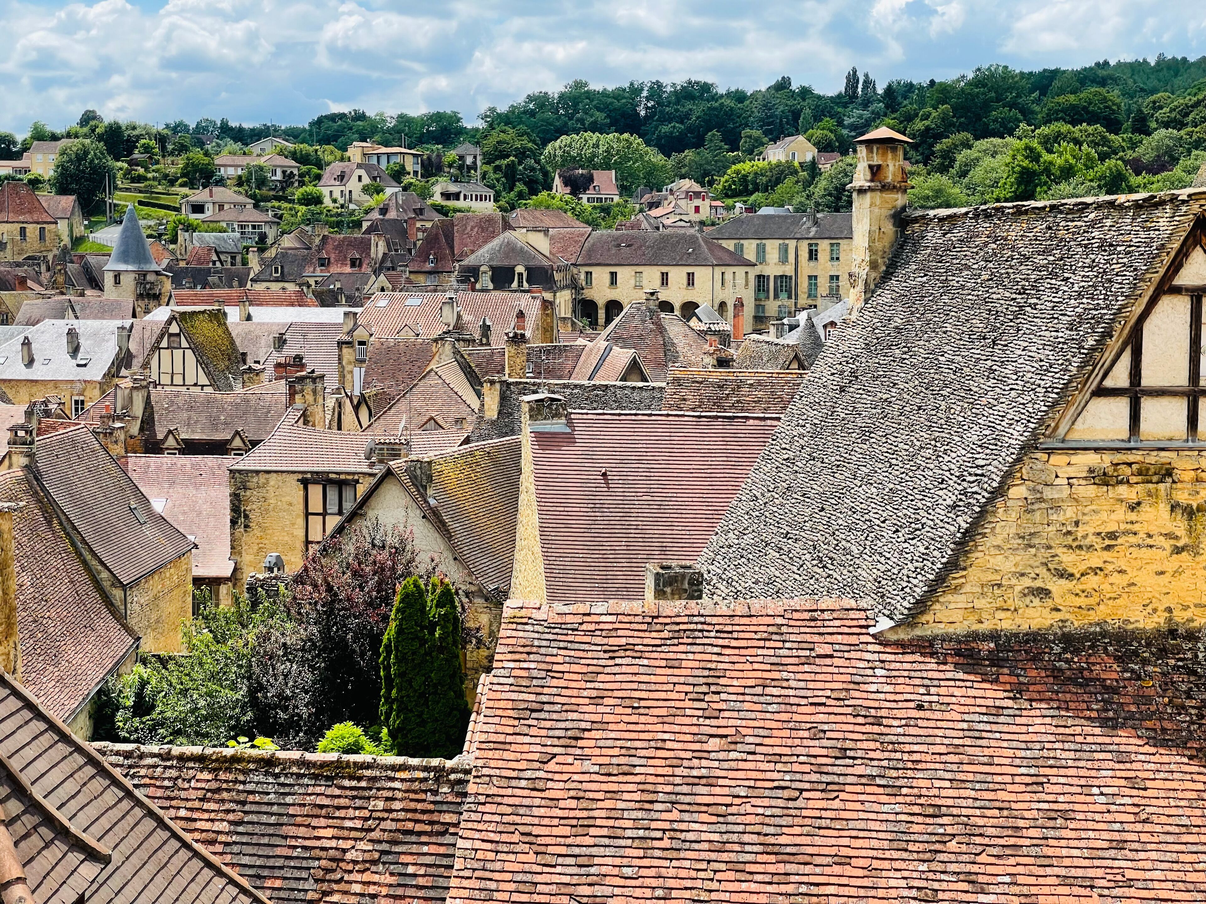 A historic town with traditional architecture, including steeply pitched roofs and timber framing.