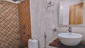 A bathroom with a toilet, a sink, and a shower. - The Farm Cottages (Nainital)